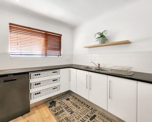 Luxury Beach Holiday Accommodation in Sunset Beach, Cape Town Scullery with sink and storage at sunset beach house luxury holiday accommodation Cape Town