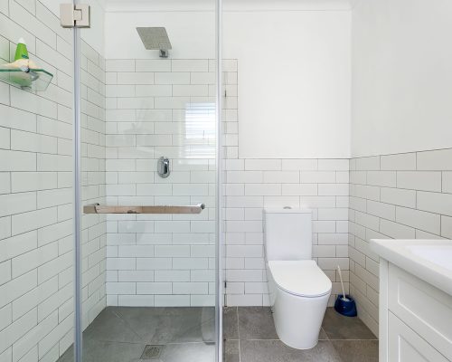 Luxury Beach Holiday Accommodation in Sunset Beach, Cape Town Modern en suite bathroom with walk in shower at sunset beach house luxury holiday accommodation Cape Town