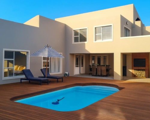Luxury Beach Holiday Accommodation in Sunset Beach, Cape Town Private pool and outdoor entertainment deck at sunset beach house luxury holiday accommodation Cape Town
